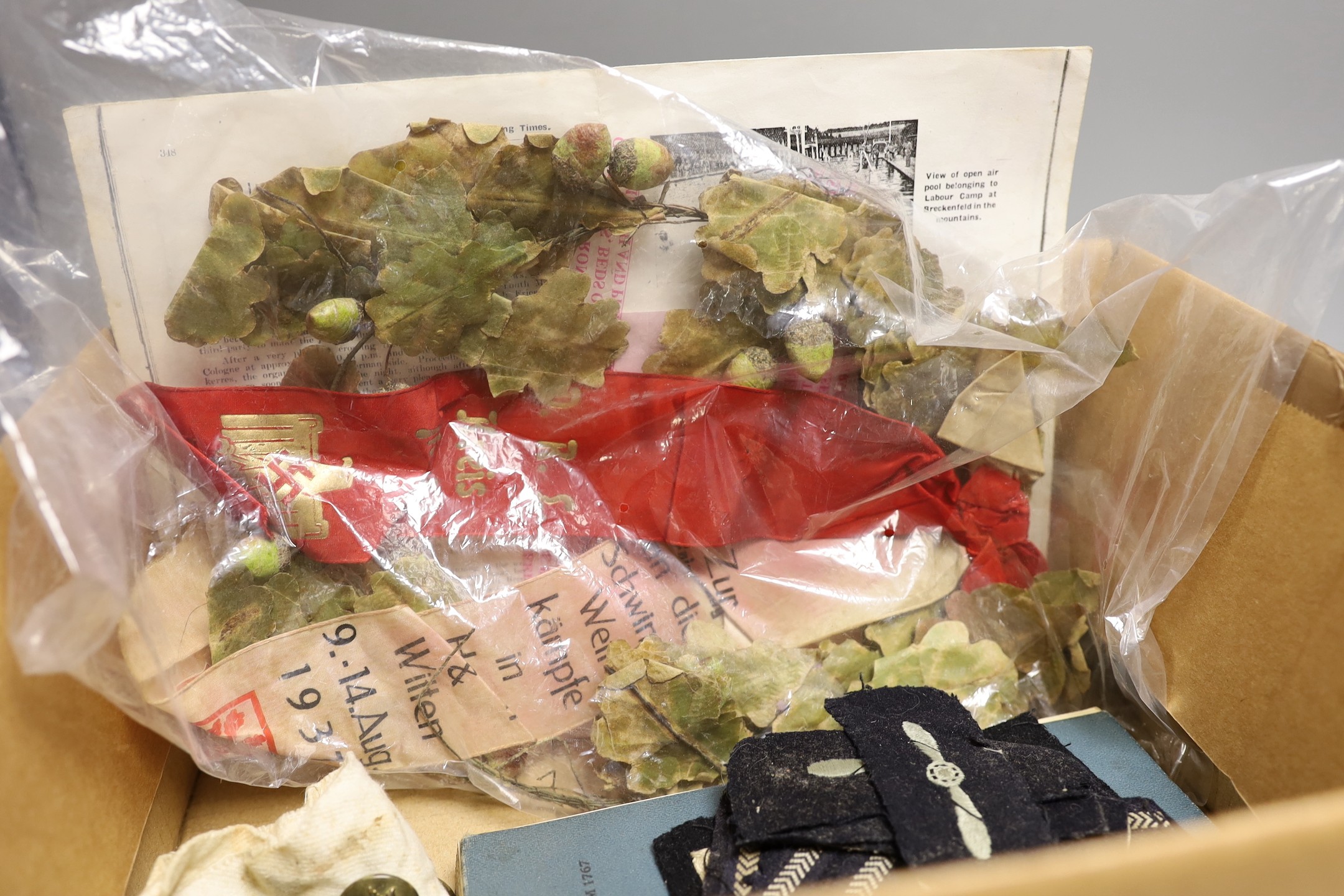 A Hitler youth knife, Observer's and Air Gunner's log-book, 1940, swimming material, all relating to George Eley, RAF